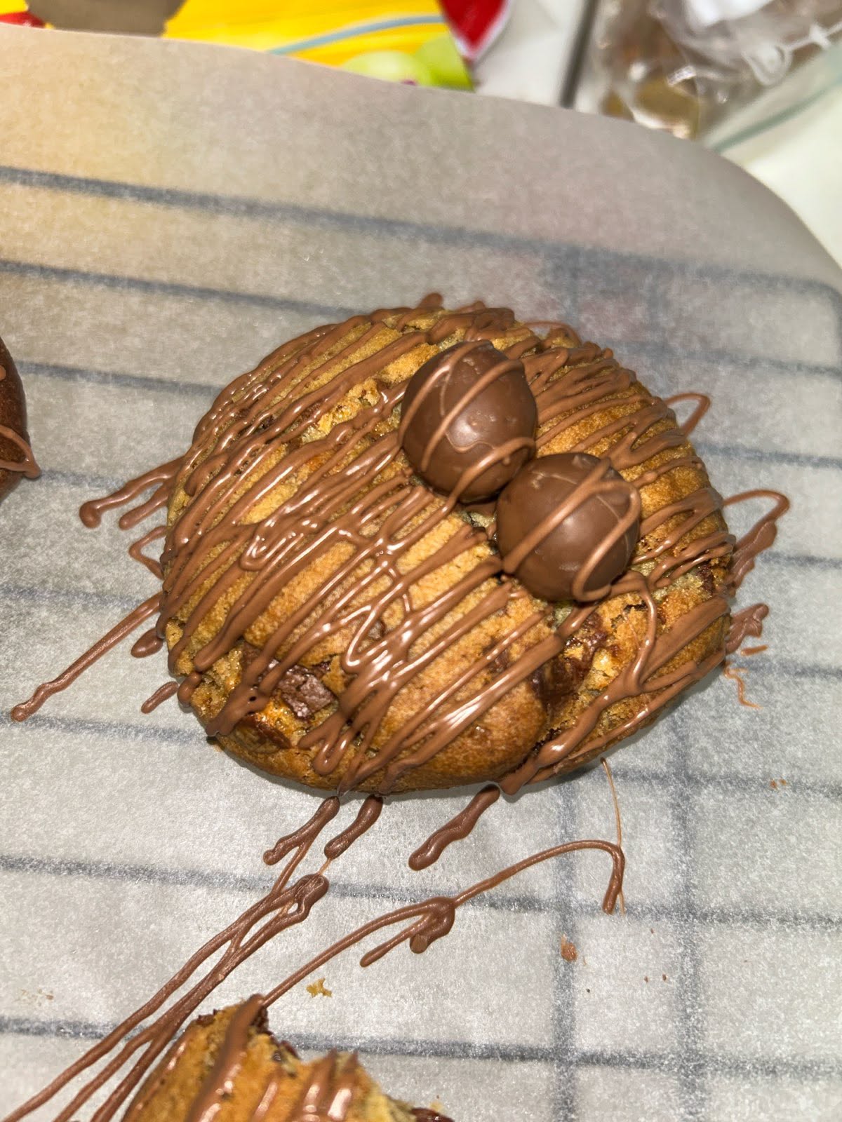 Maltesers cookie finished with whole Maltesers and chocolate drizzle