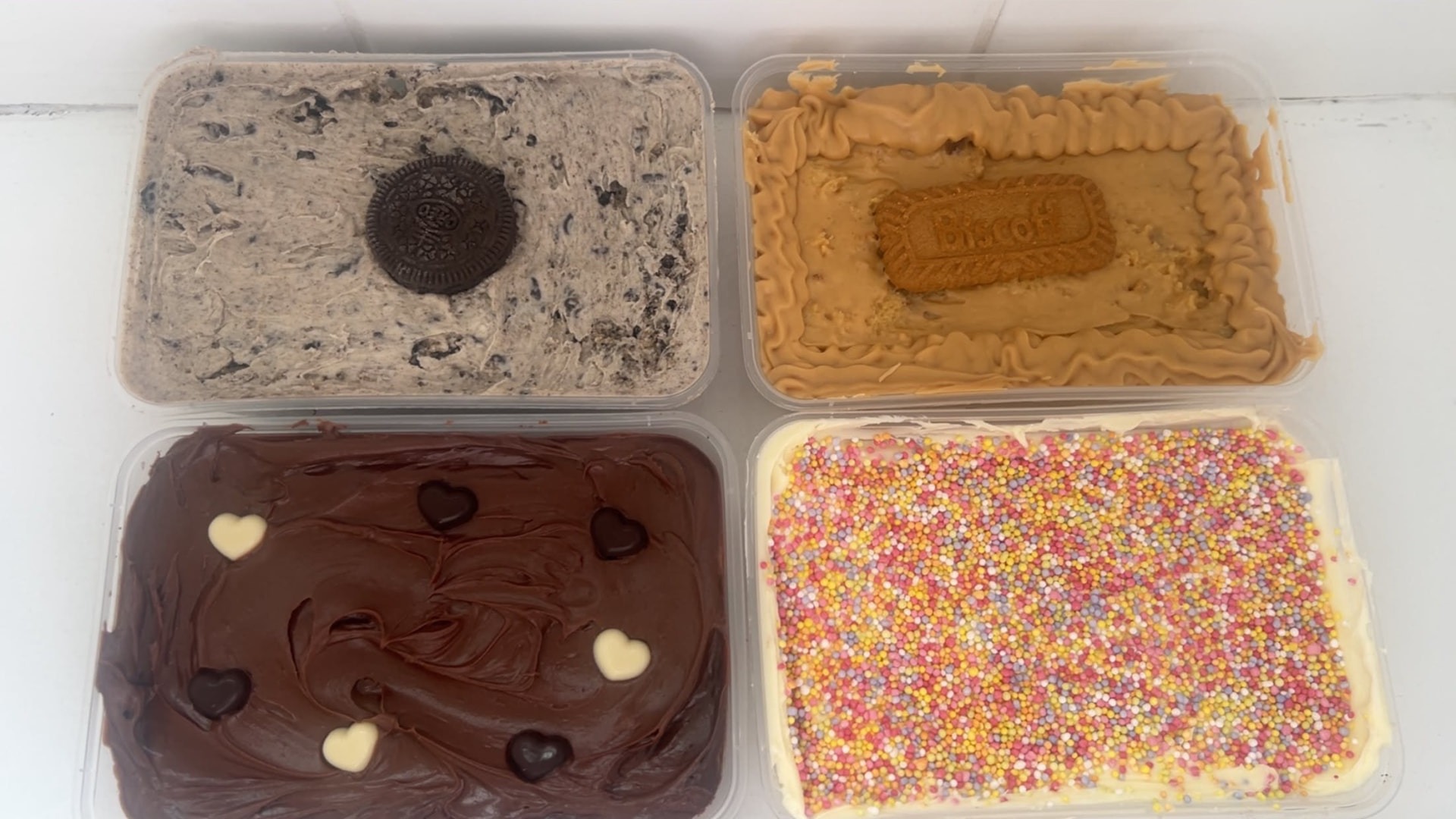 Four cake tubs by Bella & Bloom Co. in Biscoff, Oreo, Dot Cake and Chocolate